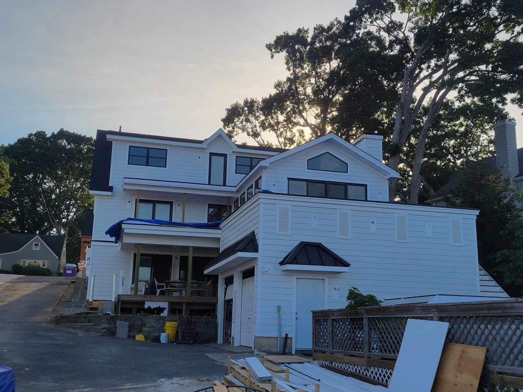 Fiber cement exterior siding on a modern Wyckoff home, showcasing durable and stylish fiber cement siding installation.